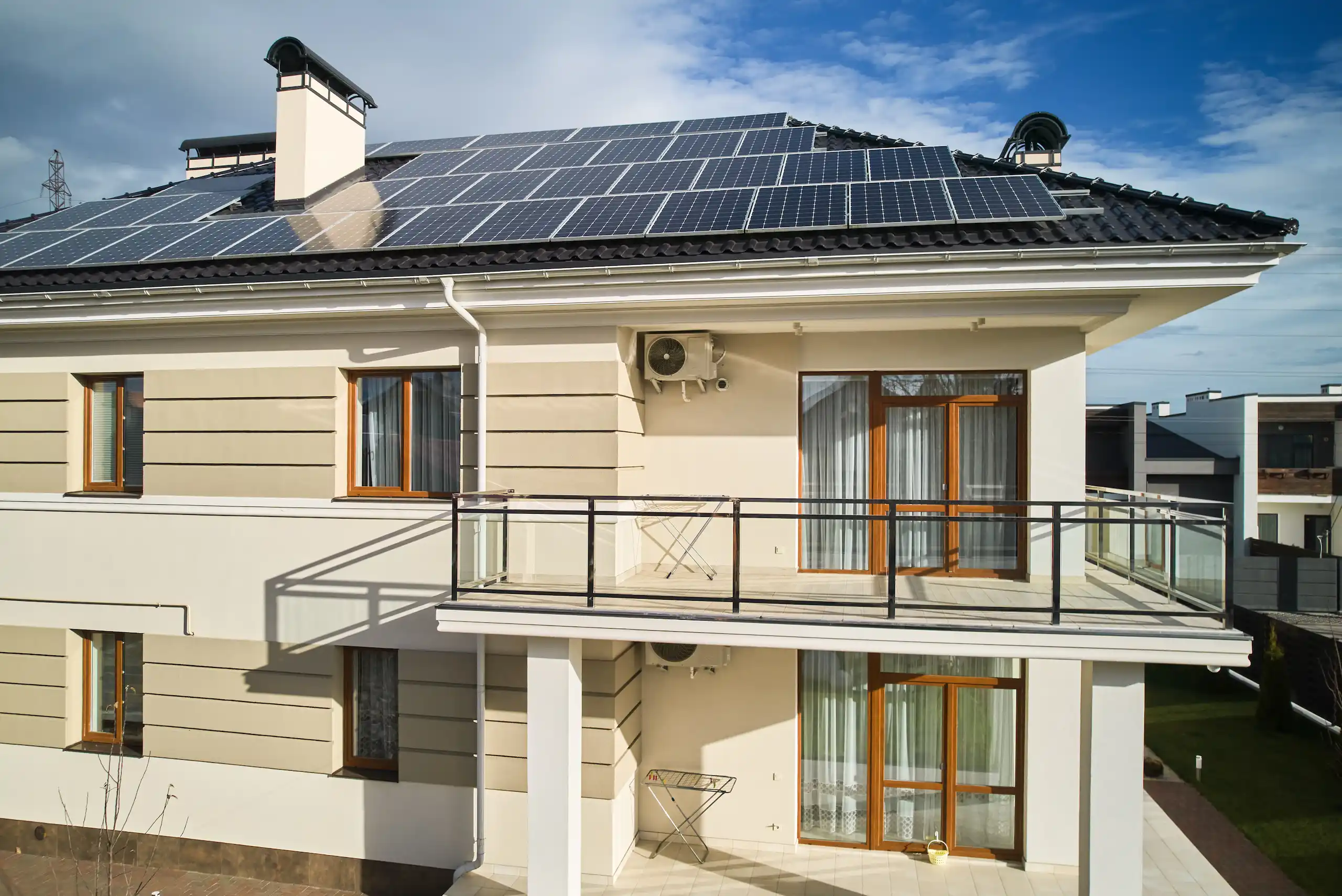 Modern Queensland home with rooftop solar panels installed, perfect example for solar rebate savings.